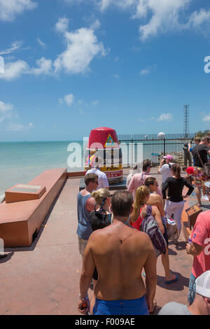 TOURISTS LINE UP IN QUEUE TO POSE BY  SOUTHERNMOST POINT IN CONTINENTAL UNITED STATES MONUMENT KEY WEST FLORIDA USA Stock Photo