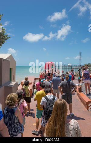 TOURISTS LINE UP IN QUEUE TO POSE BY  SOUTHERNMOST POINT IN CONTINENTAL UNITED STATES MONUMENT KEY WEST FLORIDA USA Stock Photo