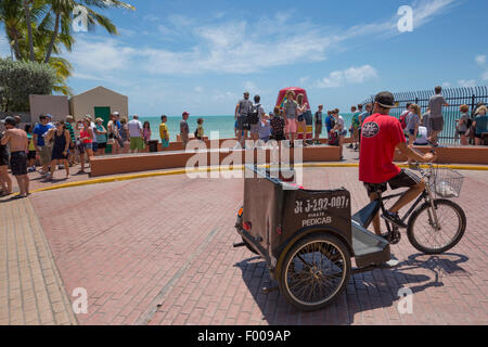 TOURISTS LINE UP IN QUEUE TO POSE BY  SOUTHERNMOST POINT IN CONTINENTAL UNITED STATES MONUMENT KEY WEST FLORIDA USA Stock Photo