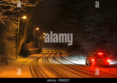 car stopping on slippery street after snowfall, Germany Stock Photo
