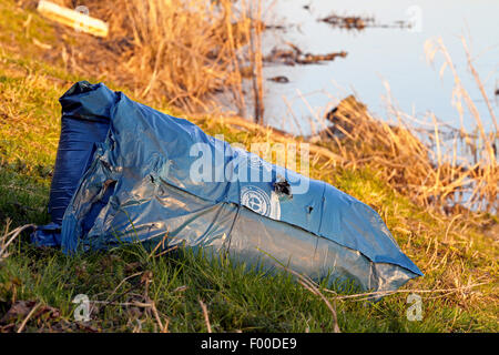 garbage bag on the lakefront, Germany Stock Photo