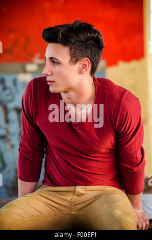 Attractive young man in urban setting looking to a side Stock Photo