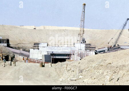 Suez Canal, Egypt - 1981 - Construction underway on the first tunnel under the Suez Canal, by the British, to be named the Ahmed Hamdi Tunnel, to aid in modernizing Egypt's road network.  Previously, all traffic from Africa to Asia (Egypt to Sinai) had to cross by ferry, a slow and time consuming method.  The Suez Canal is one of the marvels of engineering constructed in 1869 by Frenchman Ferdinand de Lesseps, it is today undergoing a signficant upgrade by adding a parallel canal to increase two-way shipping traffic and lessen waiting times. Stock Photo