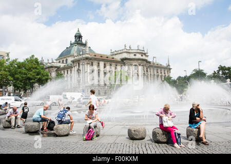 MUNICH, GERMANY - JULY 20: Tourists at Stachus fountain in Munich, Germany on July 4, 2015. Stock Photo