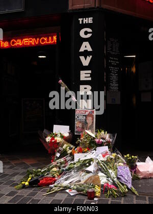 Fans of Cilla Black pay their respects with floral tributes left outside the Cavern Club, Liverpool, where her career began. Stock Photo