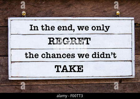 In the end, we only regret the chances we didn't take Inspirational message written on vintage wooden board. Motivational concept image Stock Photo