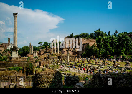 Three Pillars of the Temple of Castor and Pollux and Column of Phocas, Colonna di Foca in the Roman Forum. Stock Photo