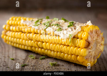Steamed sweet corn with ingredient herb on wood background Stock Photo