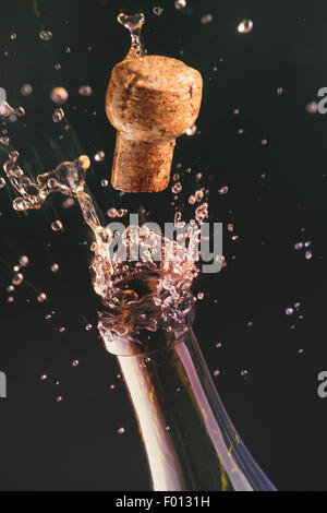 Opening a bottle of champagne. Celebration concept. Stock Photo