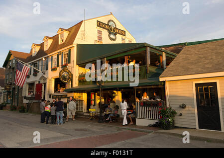 Clark Cooke House Restaurant Bowen's Wharf, diners on two levels, people in front, sun setting. Stock Photo