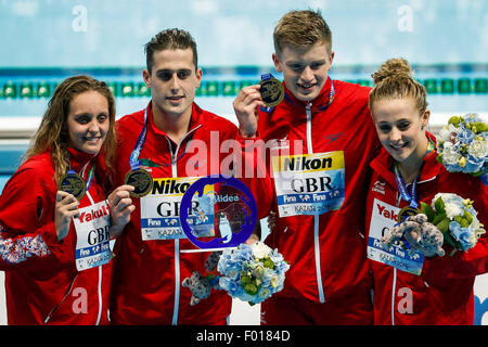 Kazan, Russia. 5th Aug, 2015. Athletes of the Great Britain pose after the Mixed 4X100 Medley Relay swimming final at FINA World Championships in Kazan, Russia, Aug. 5, 2015. The Great Britain claimed the title in a time of 3 minutes 41 seconds 71. Credit:  Zhang Fan/Xinhua/Alamy Live News Stock Photo