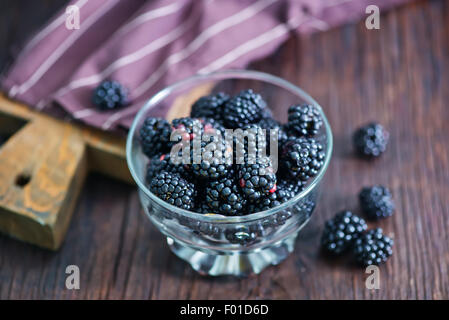 black berries in bowl on a table Stock Photo