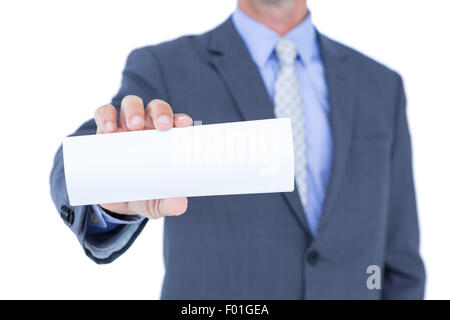 Businessman holding a white sign Stock Photo