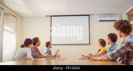 Attentive business team following a presentation Stock Photo