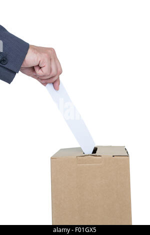 Businessman putting ballot in vote box Stock Photo