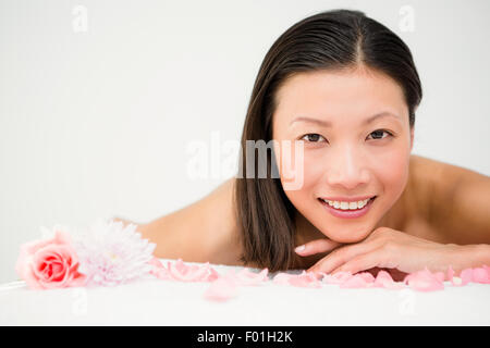 Relaxed woman lying on the massage table Stock Photo - Alamy