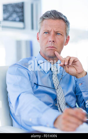 Thoughtful businessman looking away Stock Photo