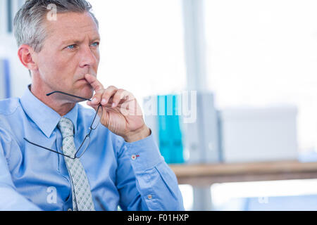 Thoughtful businessman looking away Stock Photo