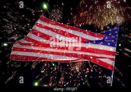 American Flag is flying and fireworks. Stock Photo