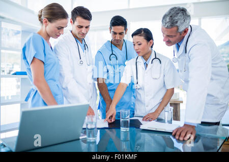 Doctors and nurses discussing together Stock Photo