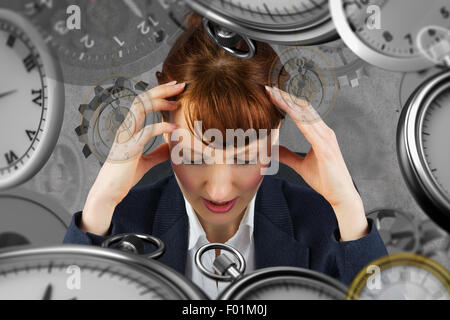Composite image of stressed businesswoman Stock Photo
