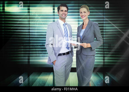 Composite image of business people looking at camera Stock Photo