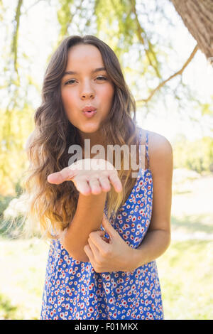 Pretty brunette blowing kiss at camera Stock Photo