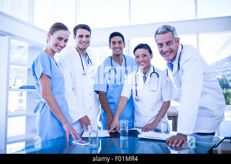 Doctors and nurses smiling at camera Stock Photo
