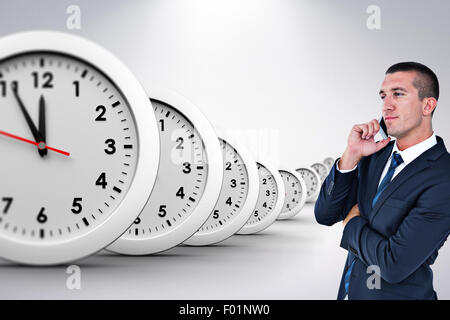 Composite image of businessman having phone call Stock Photo