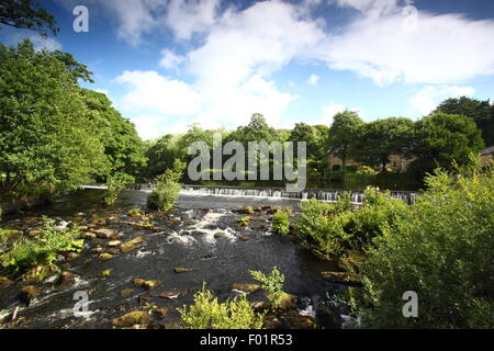 Bamford weir on the River Derwent in Bamford village in the Peak District National Park, Derbyshire, UK - summer Stock Photo