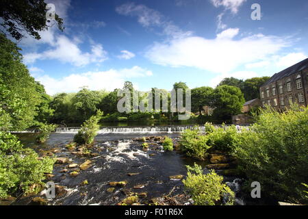 Bamford Mill and weir on the River Derwent in the Peak District National Park, England, UK Stock Photo