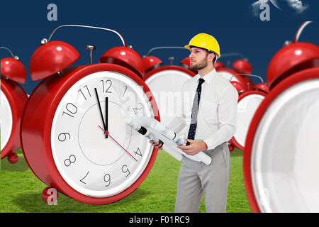Composite image of thoughtful young architect posing Stock Photo