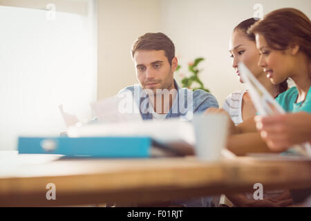 Thoughtful businessman working with his team Stock Photo