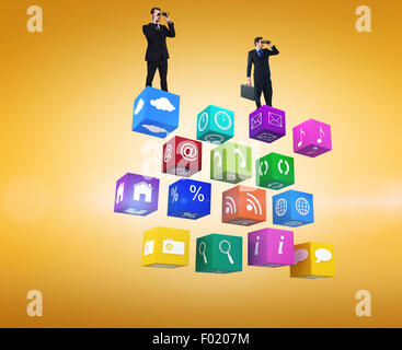 Composite image of businessman using binoculars while holding a briefcase Stock Photo