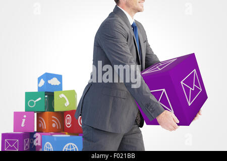 Composite image of businessman holding something with his hands Stock Photo