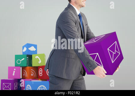 Composite image of businessman holding something with his hands Stock Photo
