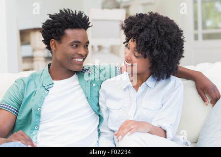 Happy couple on the couch Stock Photo