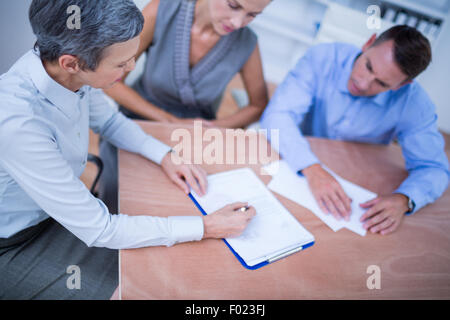 A business team brainstorming together Stock Photo