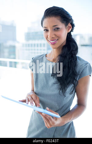 Focused businesswoman using digital tablet Stock Photo
