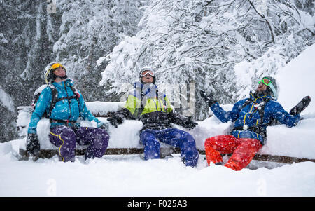 Portrait of 3 skiers enjoying heavy snowfall Stock Photo