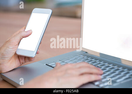 Close up view of hands typing on laptop Stock Photo