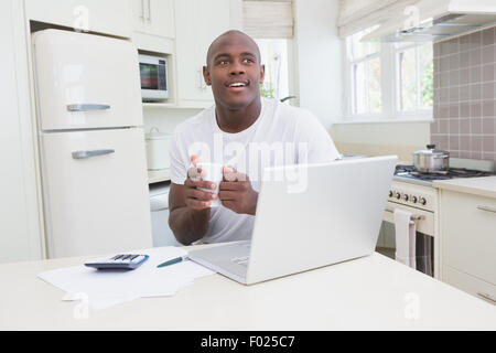 A man working and using his laptop Stock Photo