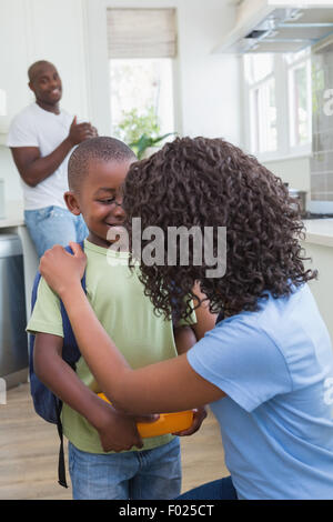 Mother and father prepare his son to going at school Stock Photo