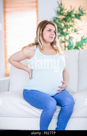 Pregnant woman getting a contraction Stock Photo