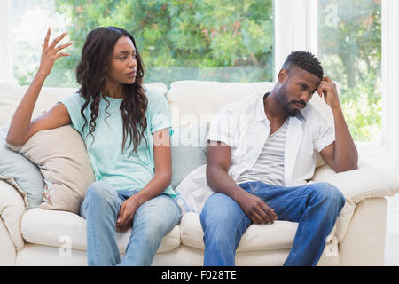 Couple having argument on the couch Stock Photo