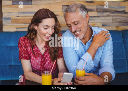 Cute couple sitting in cafe Stock Photo