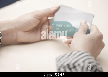 Woman holding two plastic credit cards. Horizontal photo Stock Photo