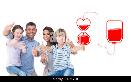 Composite image of happy family gesturing thumbs up Stock Photo