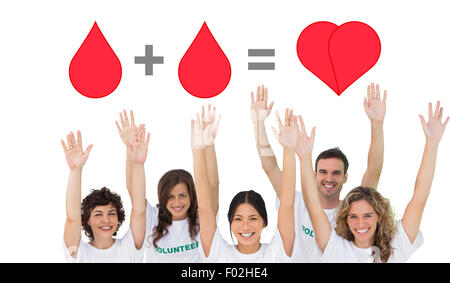 Composite image of group of volunteers raising arms Stock Photo