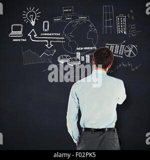 Composite image of thoughtful businessman with hand on chin Stock Photo
